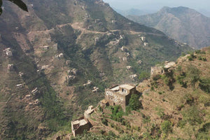 Brick buildings and ribbon terraces in Al Jafariyah District, Raymah Governorate.